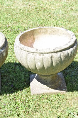 Lot 553 - Two pairs of composition stone garden urns / planters