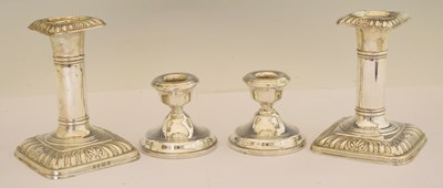 Lot 164 - Two pairs of silver candlesticks