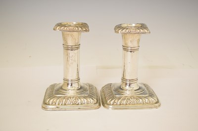 Lot 164 - Two pairs of silver candlesticks