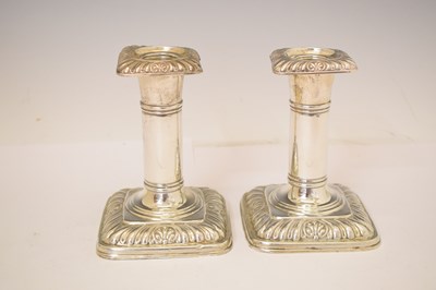 Lot 164 - Two pairs of silver candlesticks