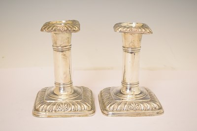 Lot 164 - Two pairs of silver candlesticks