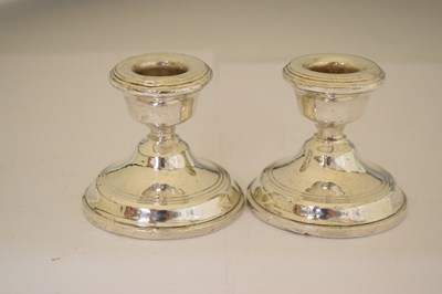 Lot 164 - Two pairs of silver candlesticks