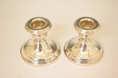 Lot 164 - Two pairs of silver candlesticks