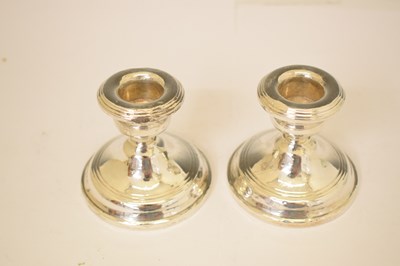 Lot 164 - Two pairs of silver candlesticks
