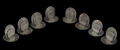 Lot Eight Edwardian silver menu holders of plain circular form