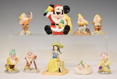 Lot 310 - Royal Doulton Disney Showcase figures of Snow White and the Seven Dwarfs