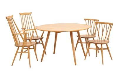 Lot 473 - Ercol - Elm drop-leaf dining table, and four chairs