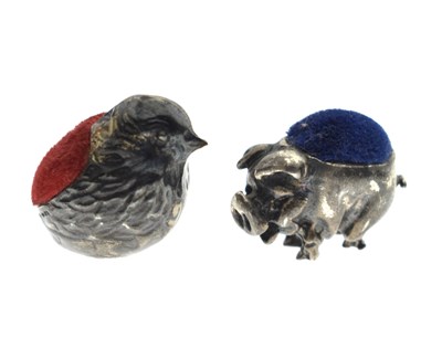 Lot 131 - Two Elizabeth II novelty silver pin cushions in the form of a pig and a hatching chick
