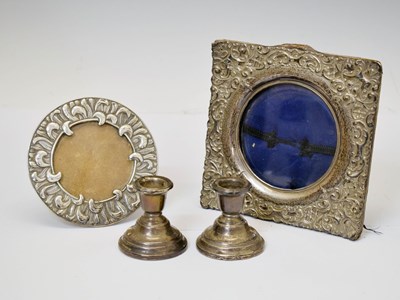 Lot 139 - Two silver frames and pair of squat table candlesticks