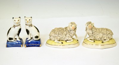Lot 301 - Pair of Staffordshire models of recumbent sheep, etc.