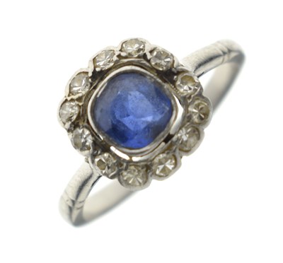 Lot 18 - Sapphire and diamond platinum cluster ring