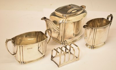 Lot 165 - George VI three-piece silver teaset together with a George V silver toast rack