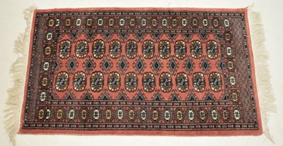Lot 488 - Tekke style pink ground wool rug
