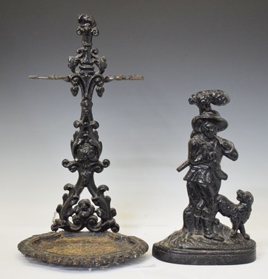 Lot 201 - Black painted iron stick stand with foliate decoration