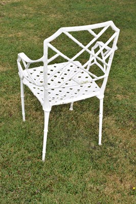Lot 543 - White painted cast metal bamboo-effect garden / patio set