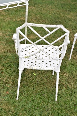 Lot 543 - White painted cast metal bamboo-effect garden / patio set