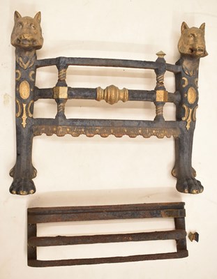 Lot 251 - Unusual cast iron fire front with animal mask decoration