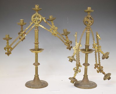 Lot 234 - Pair of early 20th century brass adjustable five-light candelabra or menorah