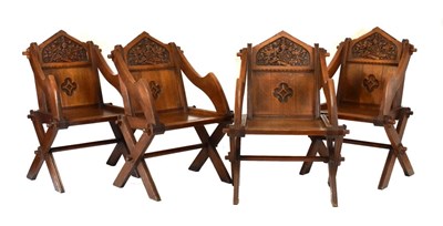 Lot 480 - Set of four craftsman-made carved oak 'Glastonbury' chairs