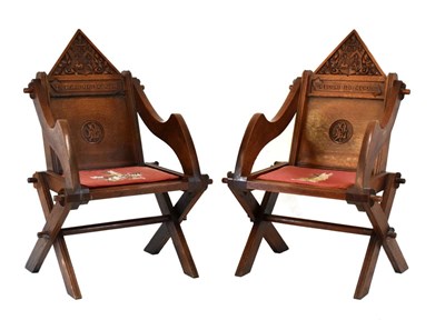 Lot 481 - Pair of Glastonbury type carved oak hall chairs