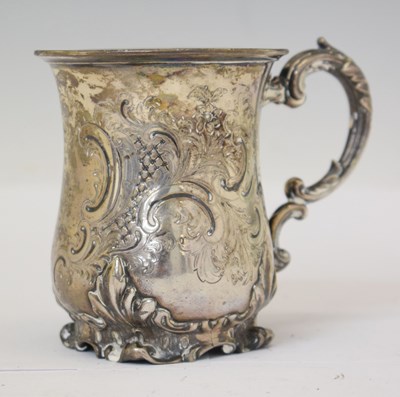 Lot 215 - Victorian silver christening mug with Rococo style decoration and scroll handle