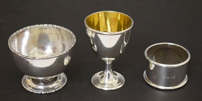 Lot 207 - Victorian silver egg cup, Elizabeth II silver napkin ring, and a George V silver pedestal bowl