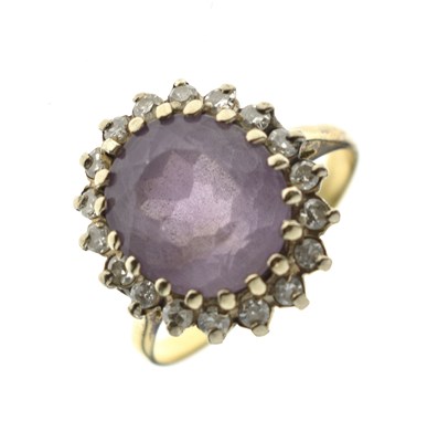Lot 22 - Amethyst and diamond cluster yellow metal ring