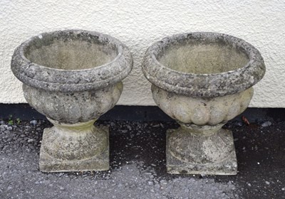 Lot 714 - Pair of 'Sandford Stone 'composite garden urns