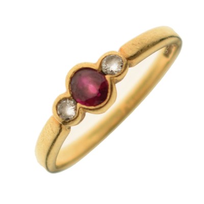 Lot 23 - Ruby and diamond 18ct gold three-stone ring
