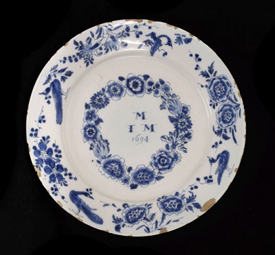 Lot 217 - Late 17th century Dutch Delft marriage plate dated 1694