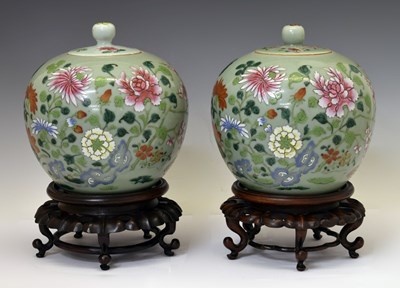 Lot 240 - Pair of Chinese Canton Famille Rose porcelain celadon jars and covers