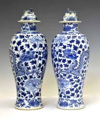 Lot 233 - Pair of Chinese blue and white porcelain vases and covers