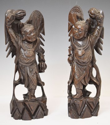 Lot 498 - Pair of silver wire-inlaid Chinese carved hardwood figures