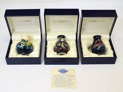 Lot 449 - Moorcroft - Three miniature vases