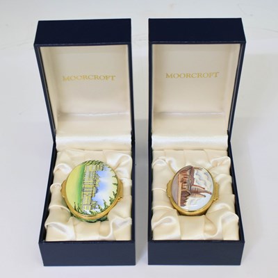 Lot 450 - Moorcroft - Two miniature enamel oval boxes with hinged covers
