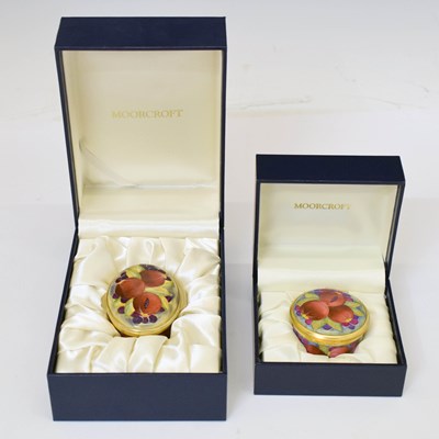 Lot 453 - Moorcroft - Two miniature enamel boxes with hinged covers