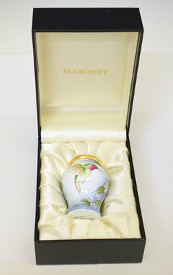 Lot 457 - Moorcroft - Miniature enamel baluster vase and cover decorated in the Shintaki pattern
