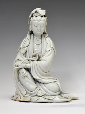 Lot 239 - Chinese Dehua blanc de chine porcelain seated figure of Guanyin