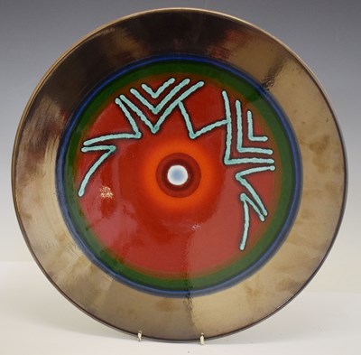 Lot 597 - Alan Clarke for Poole pottery - Limited edition 'Studio' flambe and lustre ground charger