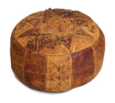 Lot 557 - Vintage brown leather pouffe, possibly North African