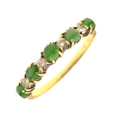 Lot 77 - Jade and diamond yellow metal ring