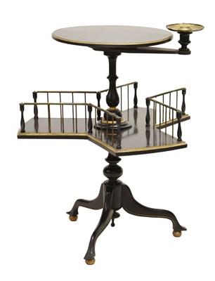 Lot 673 - Late Victorian or Edwardian ebonised book table