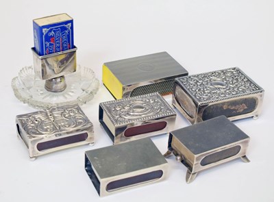 Lot 293 - Six matchbox holders together with a silver mounted and cut glass match stand