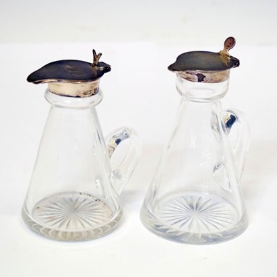 Lot 322 - Two George V silver mounted cut glass noggins
