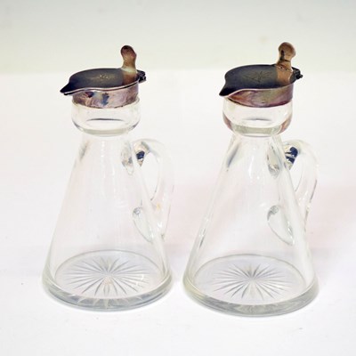 Lot 323 - Two George V silver mounted cut glass noggins