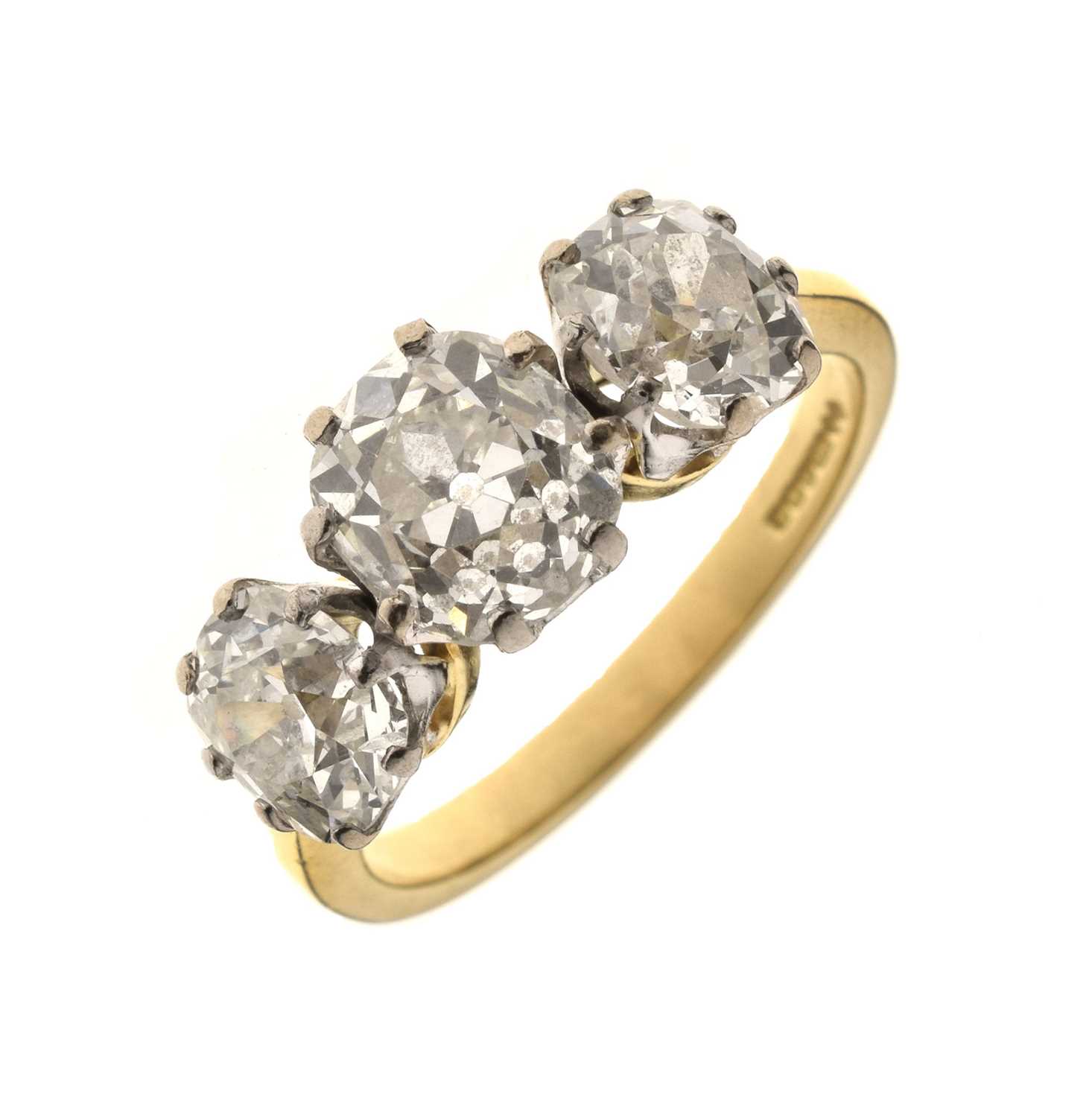 Lot 7 - Diamond three stone 18ct yellow and white gold set ring