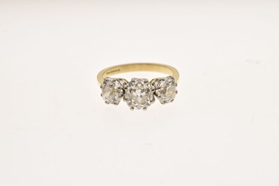 Lot 7 - Diamond three stone 18ct yellow and white gold set ring
