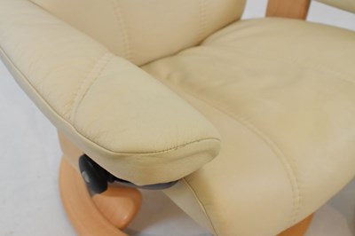Lot 696 - Ekornes 'Stressless' cream leather swivel easy chair and matching footstool