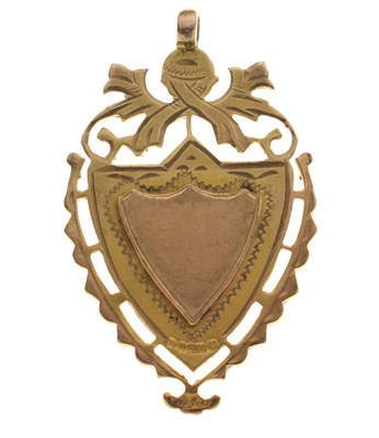 Lot 181 - 9ct gold shield-shaped fob medallion