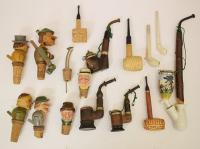 Lot 360 - Group of Swiss or Black Forest pipes and articulated bottle stoppers